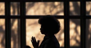 alt="image showing black woman in a church"